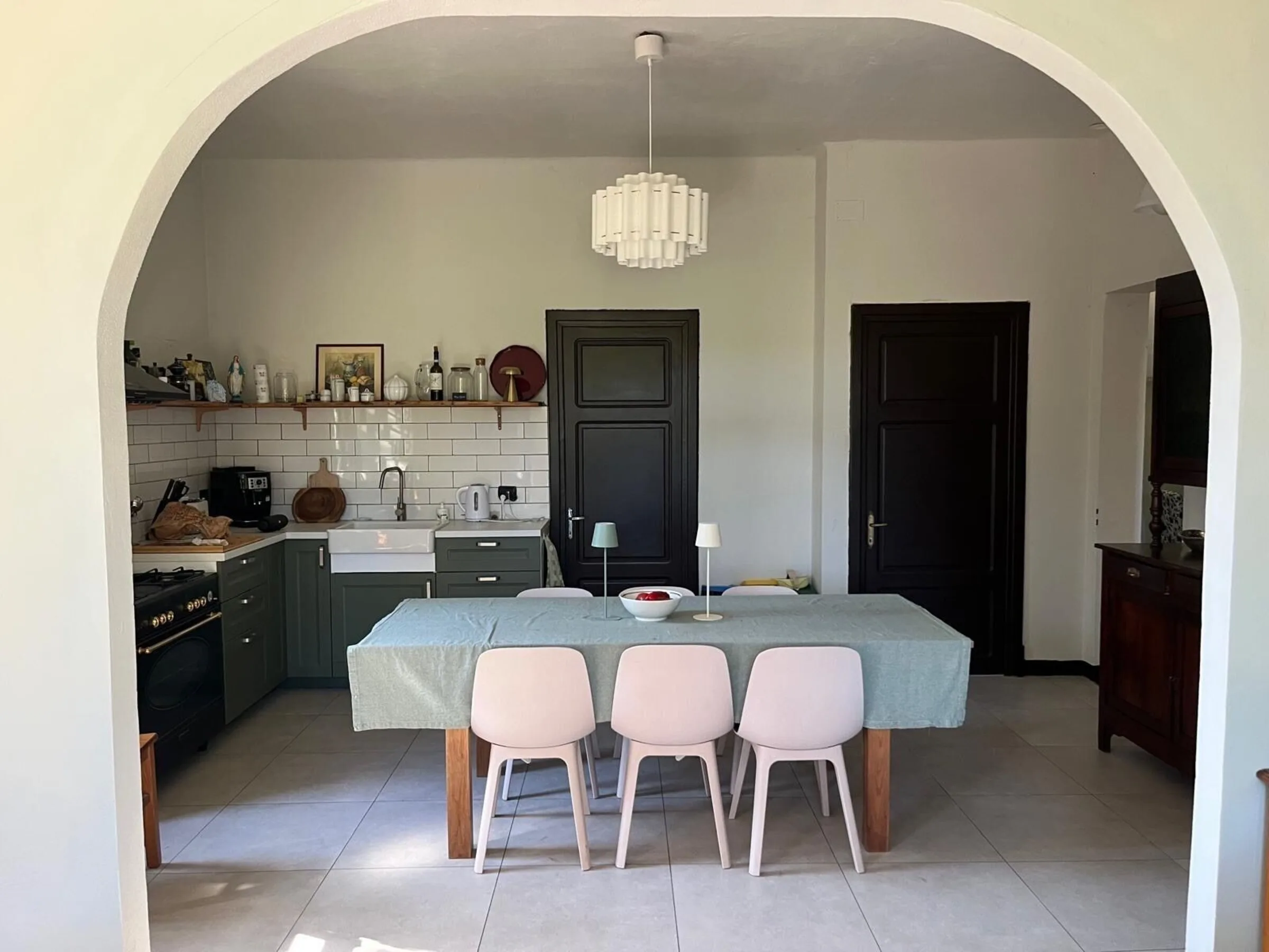 Kitchen with a central island and chandelier