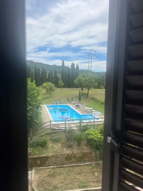 View from the window over the pool and hills